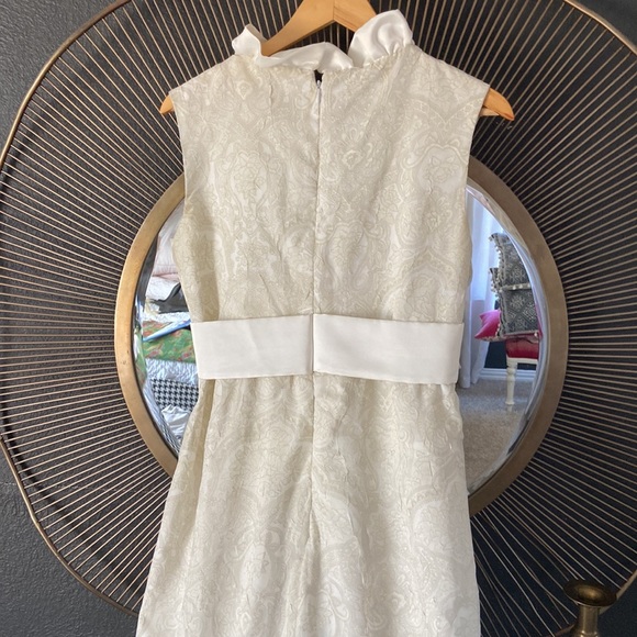 Custom made ivory tone on tone sleeveless dress with satin ruffle and bow. - Picture 6 of 7